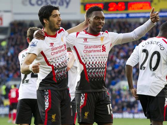 Football - 2013 2014 Premier League - Cardiff City vs. Liverpool Daniel Sturridge of Liverpool celebrates scoring Liverpool s 5th with Luis Suarez of Liverpool at the Cardiff City Stadium. COLORSPORT WINSTON BYNORTH 