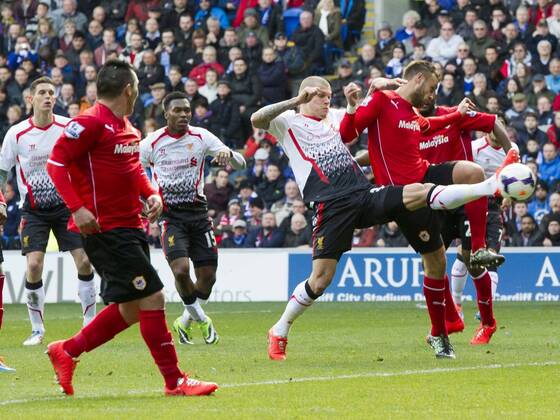 Football - 2013 2014 Premier League - Cardiff City vs. Liverpool Martin Skrtel of Liverpool scores their 2nd goal at the Cardiff City Stadium. COLORSPORT WINSTON BYNORTH 