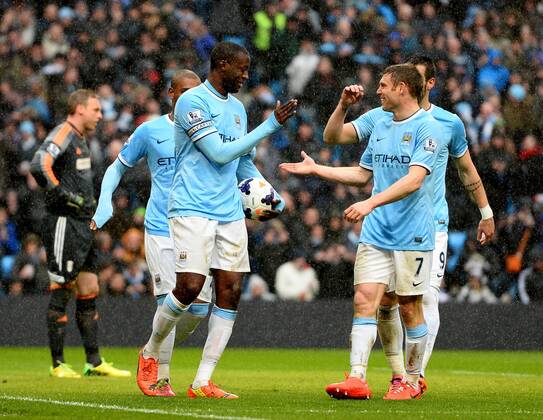 Yaya Toure of Manchester City celebrates scoring his second goal - Barclays Premier League - Manchester City vs FC Fulham - Etihad Stadium - Manchester - England - 22nd March 2014 - EDITORIAL USE ONLY. No use with unauthorised audio, video, data, fixture lists, club league logos or live services. Online in-match use limited to 120 images, no video emulation. No use in betting, games or single club league player publications.