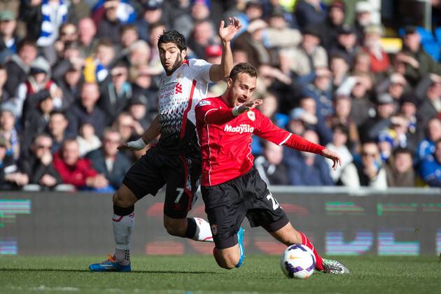 Luis Suarez of Liverpool takes down Cardiff s Juan Cala - Barclays Premier League - Cardiff City vs. FC Liverpool - Cardiff City Stadium - Cardiff - Wales - 22nd March 2014 - EDITORIAL USE ONLY. No use with unauthorised audio, video, data, fixture lists, club league logos or live services. Online in-match use limited to 120 images, no video emulation. No use in betting, games or single club league player publications.
