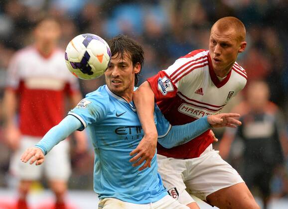 David Silva of Manchester City challenged by Steve Sidwell of Fulham - Barclays Premier League - Manchester City vs FC Fulham - Etihad Stadium - Manchester - England - 22nd March 2014 - EDITORIAL USE ONLY. No use with unauthorised audio, video, data, fixture lists, club league logos or live services. Online in-match use limited to 120 images, no video emulation. No use in betting, games or single club league player publications.