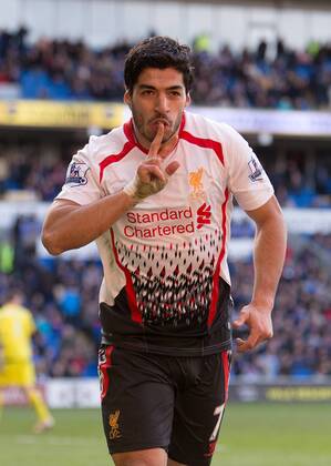 Luis Suarez of Liverpool celebrates scoring his sides sixth goal - Barclays Premier League - Cardiff City vs. FC Liverpool - Cardiff City Stadium - Cardiff - Wales - 22nd March 2014 - EDITORIAL USE ONLY. No use with unauthorised audio, video, data, fixture lists, club league logos or live services. Online in-match use limited to 120 images, no video emulation. No use in betting, games or single club league player publications.
