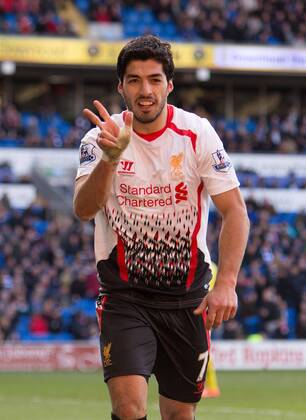 Luis Suarez of Liverpool celebrates scoring his sides sixth goal - Barclays Premier League - Cardiff City vs. FC Liverpool - Cardiff City Stadium - Cardiff - Wales - 22nd March 2014 - EDITORIAL USE ONLY. No use with unauthorised audio, video, data, fixture lists, club league logos or live services. Online in-match use limited to 120 images, no video emulation. No use in betting, games or single club league player publications.