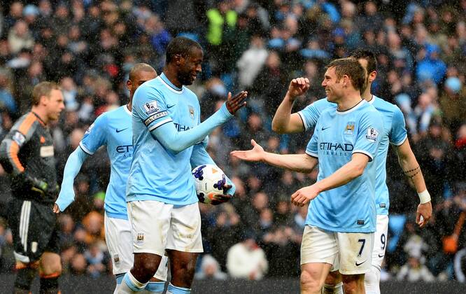 Yaya Toure of Manchester City celebrates scoring his second goal - Barclays Premier League - Manchester City vs FC Fulham - Etihad Stadium - Manchester - England - 22nd March 2014 - EDITORIAL USE ONLY. No use with unauthorised audio, video, data, fixture lists, club league logos or live services. Online in-match use limited to 120 images, no video emulation. No use in betting, games or single club league player publications.