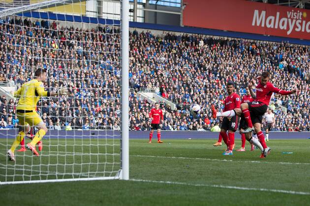 Martin Skrtel of Liverpool scores the second equalising goal - Barclays Premier League - Cardiff City vs. FC Liverpool - Cardiff City Stadium - Cardiff - Wales - 22nd March 2014 - EDITORIAL USE ONLY. No use with unauthorised audio, video, data, fixture lists, club league logos or live services. Online in-match use limited to 120 images, no video emulation. No use in betting, games or single club league player publications.