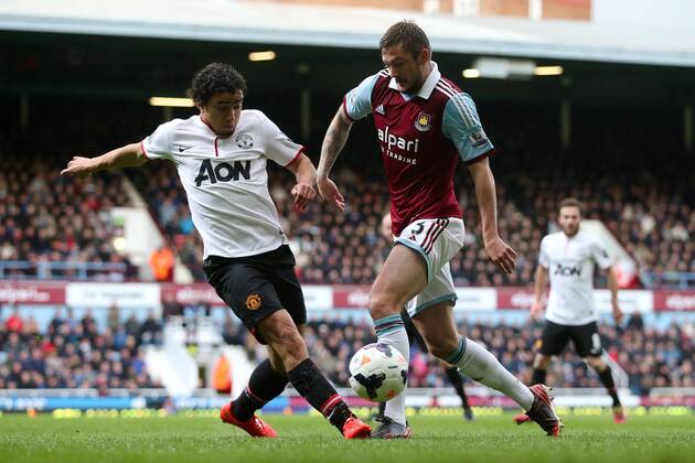 West Ham s George McCartney and Manchester United s Rafael Da Silva - West Ham United v Manchester United (ManU) - Barclays Premier League - Upton Park Stadium - London - 22nd March 2014 - EDITORIAL USE ONLY. No use with unauthorised audio, video, data, fixture lists, club league logos or live services. Online in-match use limited to 120 images, no video emulation. No use in betting, games or single club league player publications.