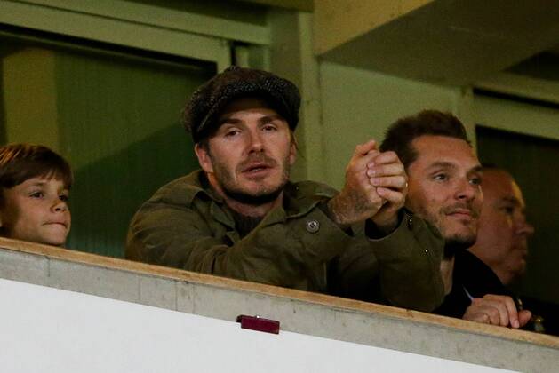 David Beckham in the crowd with son Romeo - West Ham United v Manchester United (ManU) - Barclays Premier League - Upton Park Stadium - London - 22nd March 2014 - EDITORIAL USE ONLY. No use with unauthorised audio, video, data, fixture lists, club league logos or live services. Online in-match use limited to 120 images, no video emulation. No use in betting, games or single club league player publications.