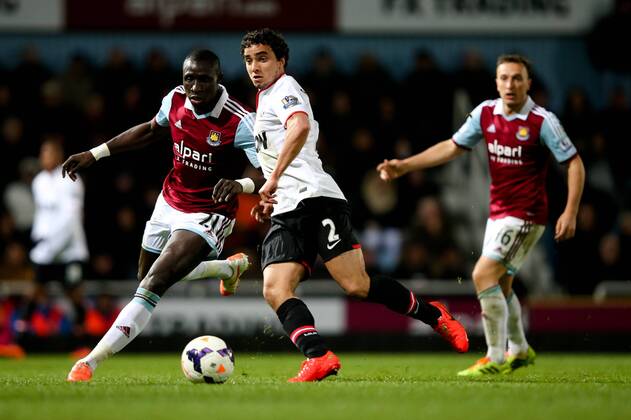 Manchester United s Rafael Da Silva and West Ham s Mohamed Diamé - West Ham United v Manchester United (ManU) - Barclays Premier League - Upton Park Stadium - London - 22nd March 2014 - EDITORIAL USE ONLY. No use with unauthorised audio, video, data, fixture lists, club league logos or live services. Online in-match use limited to 120 images, no video emulation. No use in betting, games or single club league player publications.