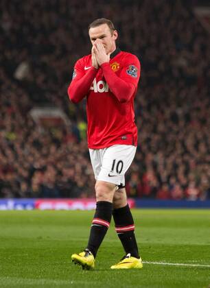 Wayne Rooney of Manchester United looks dejected - Barclays Premier League - Manchester United vs. Manchester City - Old Trafford - Manchester - England - 25th March 2014 - Picture Philip Oldham Sportimage EDITORIAL USE ONLY. No use with unauthorised audio, video, data, fixture lists, club league logos or live services. Online in-match use limited to 120 images, no video emulation. No use in betting, games or single club league player publications.