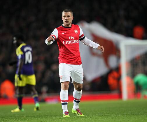 Arsenal s Lukas Podolski celebrates scoring his side opening goal Arsenal vs Swansea City - Premier League - Emirates Stadium- London - England - 25 03 2014 - Pic David Klein Sportimage EDITORIAL USE ONLY. No use with unauthorised audio, video, data, fixture lists, club league logos or live services. Online in-match use limited to 120 images, no video emulation. No use in betting, games or single club league player publications.