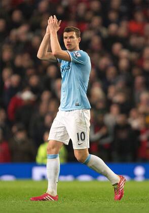 Edin Dzeko of Manchester City applauds the fans as he is substituted - Barclays Premier League - Manchester United vs. Manchester City - Old Trafford - Manchester - England - 25th March 2014 - Picture Philip Oldham Sportimage EDITORIAL USE ONLY. No use with unauthorised audio, video, data, fixture lists, club league logos or live services. Online in-match use limited to 120 images, no video emulation. No use in betting, games or single club league player publications.