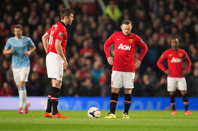 Manchester United are left dejected following the early goal - Barclays Premier League - Manchester United vs. Manchester City - Old Trafford - Manchester - England - 25th March 2014 - Picture Philip Oldham Sportimage EDITORIAL USE ONLY. No use with unauthorised audio, video, data, fixture lists, club league logos or live services. Online in-match use limited to 120 images, no video emulation. No use in betting, games or single club league player publications.