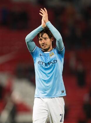 David Silva of Manchester City celebrates victory - Barclays Premier League - Manchester United vs. Manchester City - Old Trafford - Manchester - England - 25th March 2014 - Picture Philip Oldham Sportimage EDITORIAL USE ONLY. No use with unauthorised audio, video, data, fixture lists, club league logos or live services. Online in-match use limited to 120 images, no video emulation. No use in betting, games or single club league player publications.