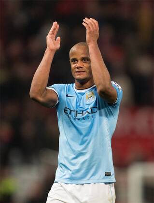 Vincent Kompany of Manchester City applauds the fans - Barclays Premier League - Manchester United vs. Manchester City - Old Trafford - Manchester - England - 25th March 2014 - Picture Philip Oldham Sportimage EDITORIAL USE ONLY. No use with unauthorised audio, video, data, fixture lists, club league logos or live services. Online in-match use limited to 120 images, no video emulation. No use in betting, games or single club league player publications.