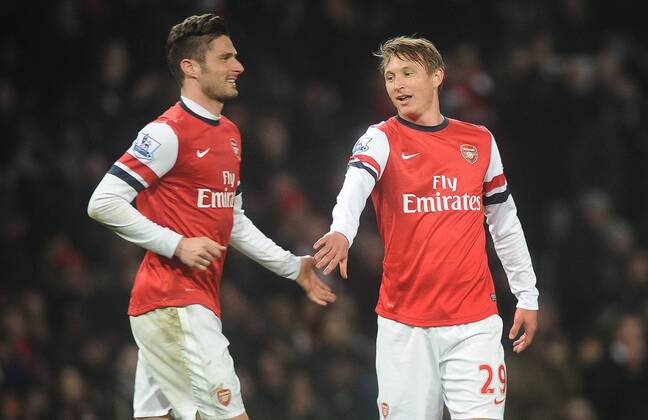 Football - 2013 2014 Premier League - Arsenal vs. Swansea City Arsenal s Kim Kallstrom congratulates Olivier Giroud after his 2nd goal at The Emirates. COLORSPORT ANDREW COWIE 