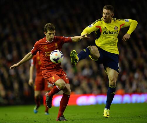 Connor Wickham of Sunderland challenges Jon Flanagan of Liverpool - Barclays Premier League - Liverpool vs Sunderland - Anfield Stadium - Liverpool - England - 26th March 2014 - Pic Simon Bellis Sportimage EDITORIAL USE ONLY. No use with unauthorised audio, video, data, fixture lists, club league logos or live services. Online in-match use limited to 120 images, no video emulation. No use in betting, games or single club league player publications.