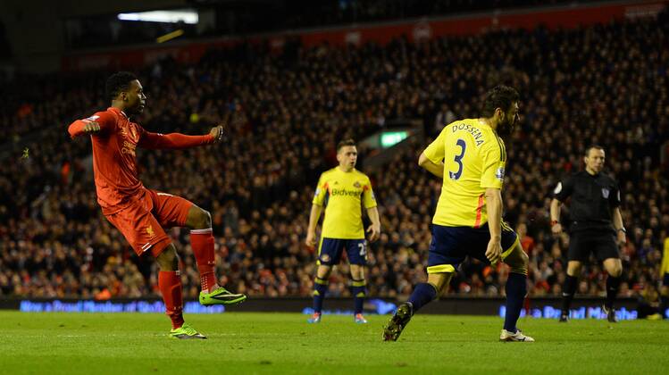 Daniel Sturridge of Liverpool watches his shot scores the second goal - Barclays Premier League - Liverpool vs Sunderland - Anfield Stadium - Liverpool - England - 26th March 2014 - Pic Simon Bellis Sportimage EDITORIAL USE ONLY. No use with unauthorised audio, video, data, fixture lists, club league logos or live services. Online in-match use limited to 120 images, no video emulation. No use in betting, games or single club league player publications.