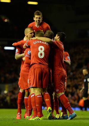 Daniel Sturridge of Liverpool is mobbed after scoring the second goal - Barclays Premier League - Liverpool vs Sunderland - Anfield Stadium - Liverpool - England - 26th March 2014 - Pic Simon Bellis Sportimage EDITORIAL USE ONLY. No use with unauthorised audio, video, data, fixture lists, club league logos or live services. Online in-match use limited to 120 images, no video emulation. No use in betting, games or single club league player publications.