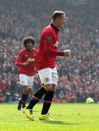 Wayne Rooney of Manchester United celebrates his second goal - Barclays Premier League - Manchester United vs. Aston Villa - Old Trafford - Manchester - England - 29th March 2014 - Picture PhilipOldham Sportimage EDITORIAL USE ONLY. No use with unauthorised audio, video, data, fixture lists, club league logos or live services. Online in-match use limited to 120 images, no video emulation. No use in betting, games or single club league player publications.