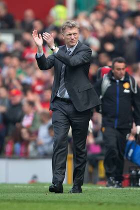 David Moyes, manager of Manchester United applauds the supporters at full time - Barclays Premier League - Manchester United vs. Aston Villa - Old Trafford - Manchester - England - 29th March 2014 - Picture Philip Oldham Sportimage EDITORIAL USE ONLY. No use with unauthorised audio, video, data, fixture lists, club league logos or live services. Online in-match use limited to 120 images, no video emulation. No use in betting, games or single club league player publications.