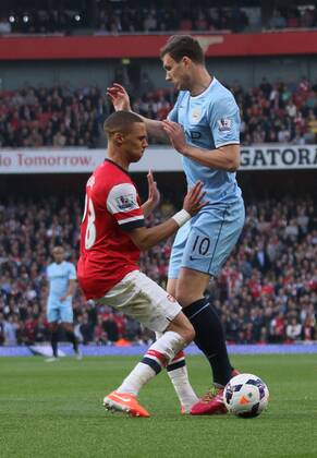 Arsenal v Manchester City . . London, UK . . 29.03.14 Kieran Gibbs (A) Edin Dzeko (MC) 