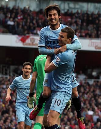 Arsenal v Manchester City . . London, UK . . 29.03.14 David Silva (MC) celebrates scoring a goal for Man City with Edin Dzeko (MC). 0-1 