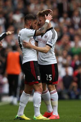 Ashkan Dejagah of Fulham celebrates scoring his side s 1st goal with Cauley Woodrow of Fulham- Fulham v Everton - Barclays Premier League - Craven Cottage Stadium - London - 29th March 2014 - Pic Charlie Forgham-Bailey Sportimage EDITORIAL USE ONLY. No use with unauthorised audio, video, data, fixture lists, club league logos or live services. Online in-match use limited to 120 images, no video emulation. No use in betting, games or single club league player publications.