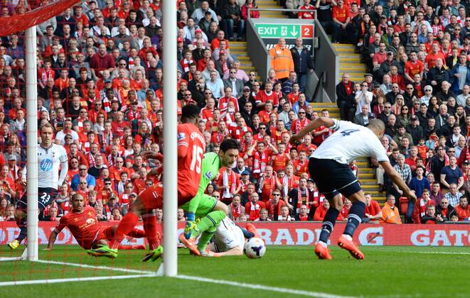 Younes Kaboul of Tottenham scores an own goal from a shot by Glen Johnson of Liverpool - Barclays Premier League - Liverpool vs Tottenham - Anfield Stadium - Liverpool - England - 30th March 2014 - Pic SimonBellis Sportimage EDITORIAL USE ONLY. No use with unauthorised audio, video, data, fixture lists, club league logos or live services. Online in-match use limited to 120 images, no video emulation. No use in betting, games or single club league player publications.