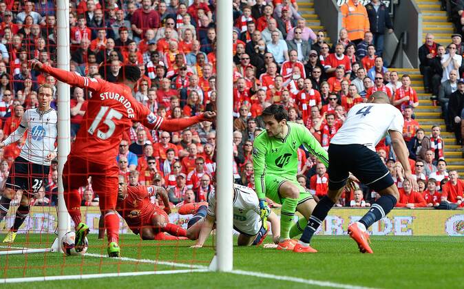 Younes Kaboul of Tottenham scores an own goal from a shot by Glen Johnson of Liverpool - Barclays Premier League - Liverpool vs Tottenham - Anfield Stadium - Liverpool - England - 30th March 2014 - Pic SimonBellis Sportimage EDITORIAL USE ONLY. No use with unauthorised audio, video, data, fixture lists, club league logos or live services. Online in-match use limited to 120 images, no video emulation. No use in betting, games or single club league player publications.