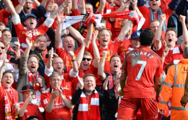 Luis Suarez of Liverpool celebrates scoring the second goal in front of the fans - Barclays Premier League - Liverpool FC - Anfield Stadium - Liverpool - England - 30th March 2014 - EDITORIAL USE ONLY. No use with unauthorised audio, video, data, fixture lists, club league logos or live services. Online in-match use limited to 120 images, no video emulation. No use in betting, games or single club league player publications.