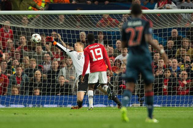Manuel Neuer of Munich saves a chance on goal from Danny Welbeck of Manchester United (ManU) - UEFA Champions League - Manchester United (ManU) vs. Bayern Munich FC - Old Trafford - Manchester - - 1st April 2014 - Picture PhilipxOldham Sportimage EDITORIAL USE ONLY. No use with unauthorised audio, video, data, fixture lists, club league logos or live services. Online in-match use limited to 120 images, no video emulation. No use in betting, games or single club league player publications.