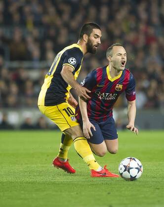 Barcelona, ESPANA - April 01 - UEFA Champions League 2013 2014 - - FC Barcelona (Barca) vs Atletico Madrid - (Photo: VictorxSalgado Cordon Press) Arda Turan - Andres Iniesta 