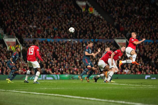 Nemanja Vidic of Manchester United (ManU) opens the scoring with a header - UEFA Champions League - Manchester United (ManU) vs. Bayern Munich FC - Old Trafford - Manchester - - 1st April 2014 - Picture PhilipxOldham Sportimage EDITORIAL USE ONLY. No use with unauthorised audio, video, data, fixture lists, club league logos or live services. Online in-match use limited to 120 images, no video emulation. No use in betting, games or single club league player publications.