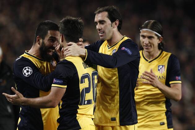 BARCELONA, April 1, 2014 (Xinhua) -- Atletico Madrid s Diego Ribas (2nd L) celebrates with his teammats after scoring against Barcelona during their UEFA Champions League quarter-final first leg match at Camp Nou stadium in Barcelona, Spain, April 1, 2014. The match ended in a 1-1 draw. (Xinhua Pau Barrena) (SP)SPAIN-BARCELONA-UEFA CHAMPIONS LEAGUE-QUARTERFINAL-BARCELONA VS ATLETICO MADRID 
