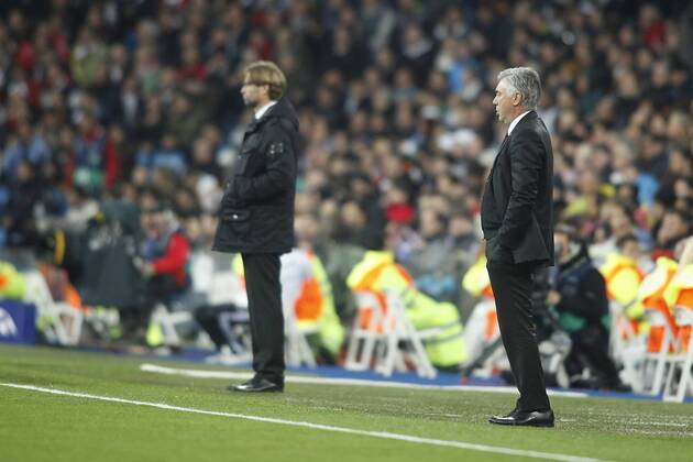 Real Madrid s coach Carlo Ancelotti (R) and Borussia Dortmund s coach Jurgen Klopp during a first leg quarterfinal Champions League soccer match between Real Madrid and Borussia Dortmund at Santiago Bernabeu stadium in Madrid.  (2014040214519)