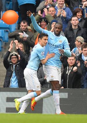 Yaya Toure of Manchester City celebrates scoring a penalty - Barclays Premier League - Manchester City v Southampton - Etihad Stadium - Manchester - England - 5th April 2014 - Pic Simon Bellis Sportimage EDITORIAL USE ONLY. No use with unauthorised audio, video, data, fixture lists, club league logos or live services. Online in-match use limited to 120 images, no video emulation. No use in betting, games or single club league player publications.