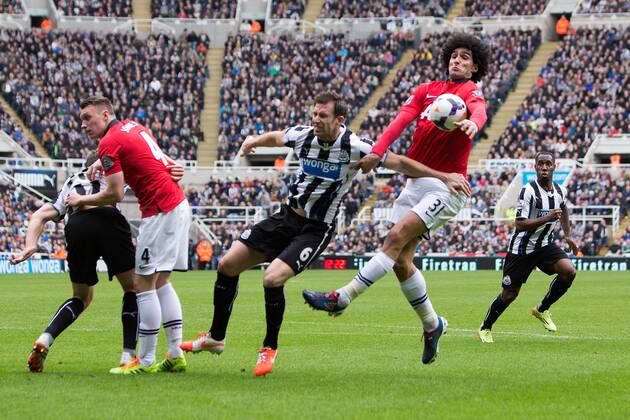 Marouane Fellaini of Manchester United handles the ball - Barclays Premier League - Newcastle United vs. Manchester United - St James Park - Newcastle - England - 5th April 2014 - Picture Philip Oldham Sportimage EDITORIAL USE ONLY. No use with unauthorised audio, video, data, fixture lists, club league logos or live services. Online in-match use limited to 120 images, no video emulation. No use in betting, games or single club league player publications.