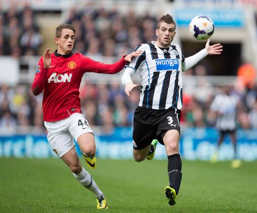 Adnan Januzaj of Manchester United and Davide Santon of Newcastle United battle - Barclays Premier League - Newcastle United vs. Manchester United - St James Park - Newcastle - England - 5th April 2014 - Picture Philip Oldham Sportimage EDITORIAL USE ONLY. No use with unauthorised audio, video, data, fixture lists, club league logos or live services. Online in-match use limited to 120 images, no video emulation. No use in betting, games or single club league player publications.