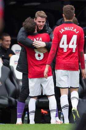 Juan Mata of Manchester United celebrates his opening goal with fellow Spaniard David de Gea - Barclays Premier League - Newcastle United vs. Manchester United - St James Park - Newcastle - England - 5th April 2014 - Picture Philip Oldham Sportimage EDITORIAL USE ONLY. No use with unauthorised audio, video, data, fixture lists, club league logos or live services. Online in-match use limited to 120 images, no video emulation. No use in betting, games or single club league player publications.