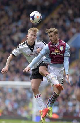 Lewis Holtby of Fulham competes with Joe Bennett of Aston Villa (right) - Football - Barclays Premier League - Aston Villa vs Fulham - Villa Park Birmingham - Season 13 14 - 05 04 2014 Pic Malcolm Couzens Sportimage EDITORIAL USE ONLY. No use with unauthorised audio, video, data, fixture lists, club league logos or live services. Online in-match use limited to 120 images, no video emulation. No use in betting, games or single club league player publications.