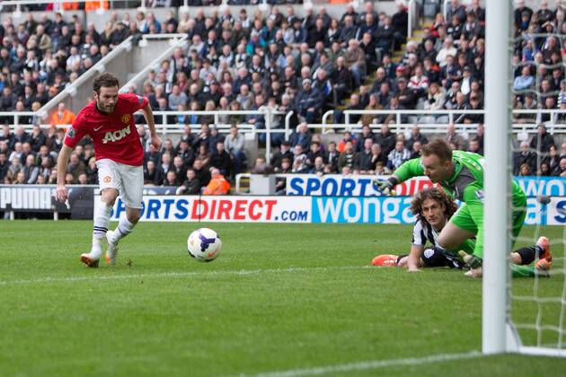 Juan Mata of Manchester United scpres his second goal - Barclays Premier League - Newcastle United vs. Manchester United - St James Park - Newcastle - England - 5th April 2014 - Picture Philip Oldham Sportimage EDITORIAL USE ONLY. No use with unauthorised audio, video, data, fixture lists, club league logos or live services. Online in-match use limited to 120 images, no video emulation. No use in betting, games or single club league player publications.