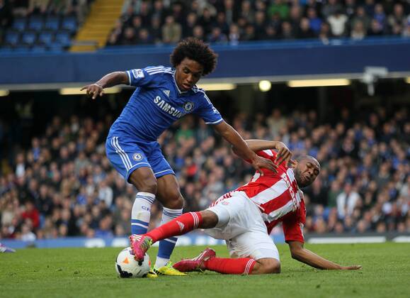 Chelsea s Willian tussles with Stoke s Wilson Palacios Chelsea vs Stoke City- Premier League - Stamford Bridge- London - England - 05 03 2014 - Pic David Klein Sportimage EDITORIAL USE ONLY. No use with unauthorised audio, video, data, fixture lists, club league logos or live services. Online in-match use limited to 120 images, no video emulation. No use in betting, games or single club league player publications.