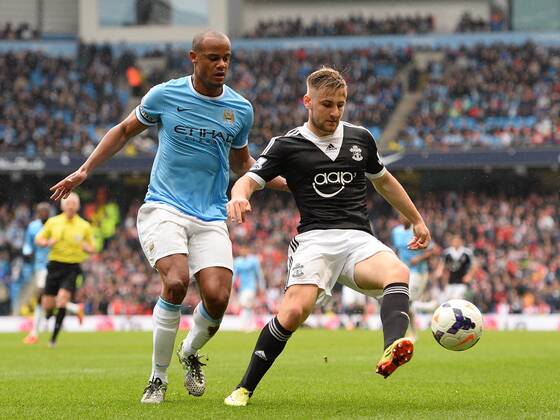 Vincent Kompany of Manchester City and Luke Shaw of Southampton - Barclays Premier League - Manchester City v Southampton - Etihad Stadium - Manchester - England - 5th April 2014 - Pic Simon Bellis Sportimage EDITORIAL USE ONLY. No use with unauthorised audio, video, data, fixture lists, club league logos or live services. Online in-match use limited to 120 images, no video emulation. No use in betting, games or single club league player publications.