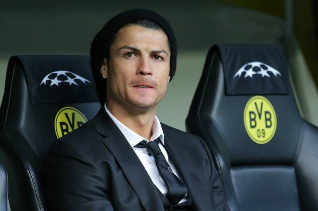 08.04.2014, xgsx, Fussball Champions League, Borussia Dortmund - Real Madrid, v.l. Cristiano Ronaldo (Real Madrid - 7) im Anzug auf der Bank in Dortmund