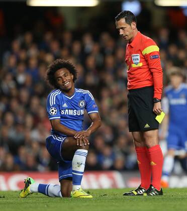 Chelsea s Willian looks on having got a booking Chelsea vs Paris Saint Germain- Champions League, Knockout - Stamford Bridge - London - England - 08 04 2014 - EDITORIAL USE ONLY. No use with unauthorised audio, video, data, fixture lists, club league logos or live services. Online in-match use limited to 120 images, no video emulation. No use in betting, games or single club league player publications.