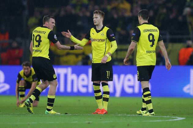 08.04.2014, xgsx, Fussball Champions League, Borussia Dortmund - Real Madrid, v.l. Kevin Grosskreutz (BVB Borussia Dortmund - 19) - Marco Reus (BVB Borussia Dortmund - 11) - Robert Lewandowski (BVB Borussia Dortmund - 9) bejubeln das Tor zum 1-0 durch Marco Reus (BVB Borussia Dortmund - 11)