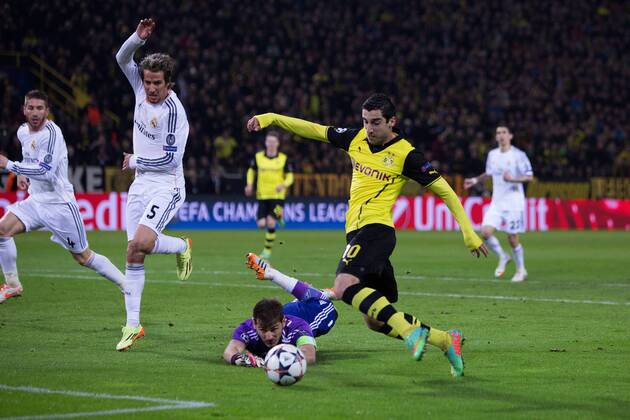 Henrich Mchitarjan of Dortmund takes the ball around Iker Casillas of Real Madrid but fails to score - UEFA Champions League - Quarter Final 2nd Leg - Borussia Dortmund vs. Real Madrid - Signal Iduna Park - Dortmund - Germany - 8th April 2014 - Picture Philip Oldham Sportimage EDITORIAL USE ONLY. No use with unauthorised audio, video, data, fixture lists, club league logos or live services. Online in-match use limited to 120 images, no video emulation. No use in betting, games or single club league player publications.