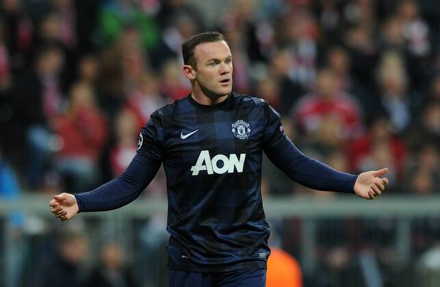 Football - 2013 2014 Champions League - Quarter-Final, Second Leg: Bayern Munich vs. Manchester United Wayne Rooney of Manchester United protests his innocence following a foul on Dante of Bayern Munich at the Allianz Arena, Munich 