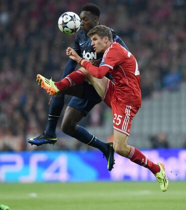 FUSSBALL CHAMPIONS LEAGUE VIERTELFINALE SAISON 2013 2014 FC Bayern München - Manchester United FC 09.04.2014 Daniel Welbeck (hinten, Manchester United FC) gegen Thomas Müller (vorn, FC Bayern München) 