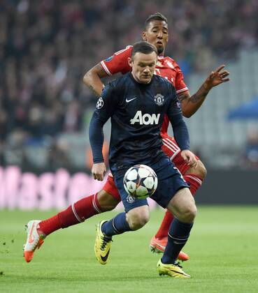 FUSSBALL CHAMPIONS LEAGUE VIERTELFINALE SAISON 2013 2014 FC Bayern München - Manchester United FC 09.04.2014 Wayne Rooney (Manchester United FC) vor Jerome Boateng (FC Bayern München) 